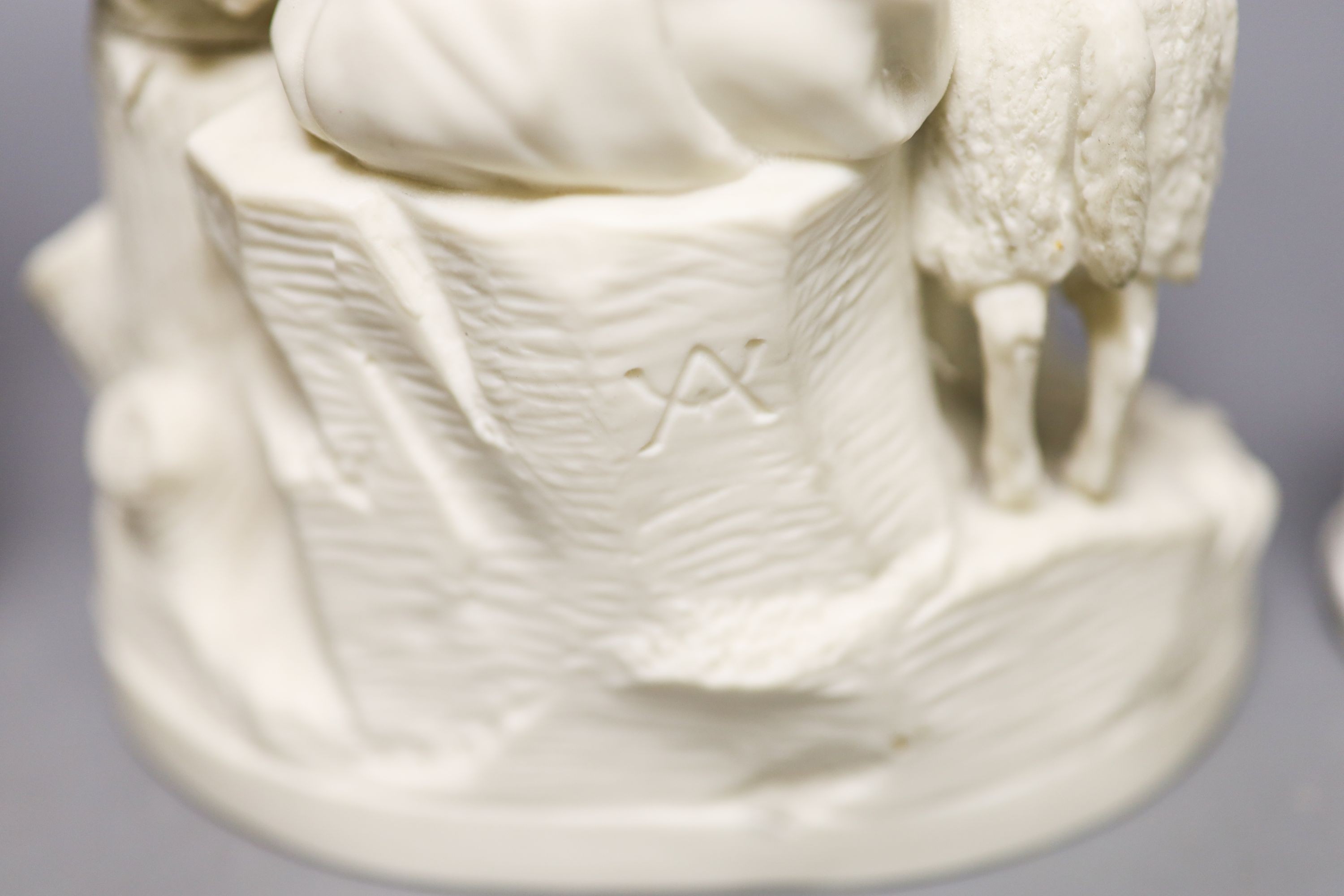 A Samuel Alcock parian group of a maid and sheep, a similar Minton biscuit group and a Samson porcelain group in Derby style Tallest 27cm